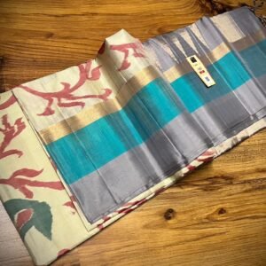 Ivory Silk Saree with Stylized Floral Motifs and Teal–Grey Gold Zari Border