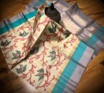 Ivory Silk Saree with Stylized Floral Motifs and Teal–Grey Gold Zari Border