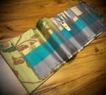 Pista Green Floral Silk Saree with Gold Zari Border and Teal Highlights