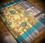 Pista Green Floral Silk Saree with Gold Zari Border and Teal Highlights
