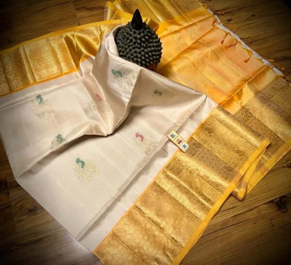 Ivory Elegance Silk Saree with Regal Gold Zari Border