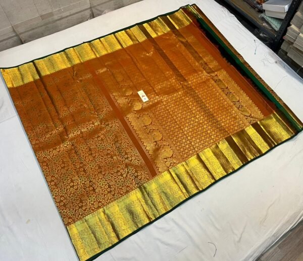 Antique Copper Silk Saree with Intricate Gold Zari Weave and Forest Green Border