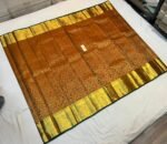 Antique Copper Silk Saree with Intricate Gold Zari Weave and Forest Green Border