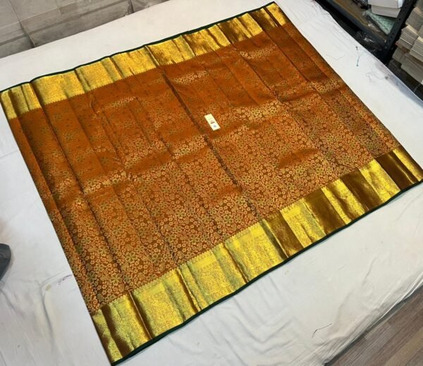 Antique Copper Silk Saree with Intricate Gold Zari Weave and Forest Green Border