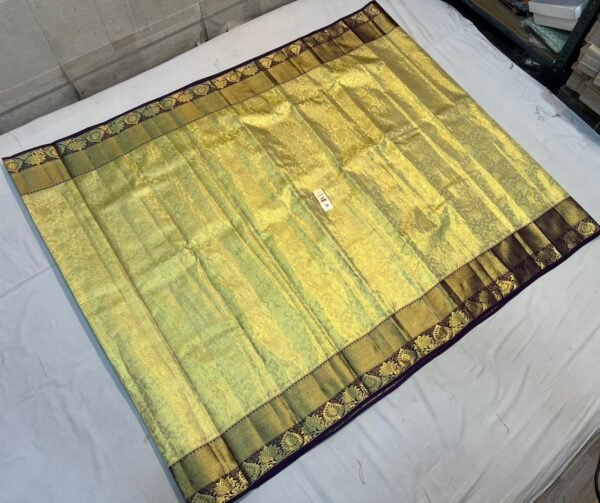 Timeless Gold Zari Silk Saree with Green Undertones and Purple Floral Border