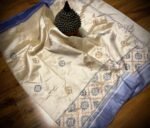 Elegant Ivory Tussar Silk Saree with Pastel Buttas & Blue Border