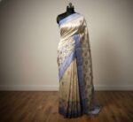 Elegant Ivory Tussar Silk Saree with Pastel Buttas & Blue Border