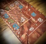 Copper Rust Satin Saree with Multicolor Elephant Motifs & Zari Peacock Border