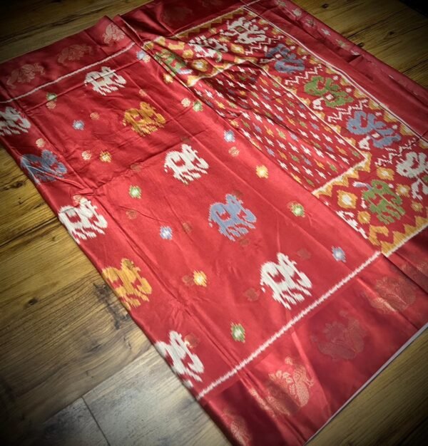 Radiant Ruby Red Satin Saree with Multicolor Elephant Motifs & Zari Peacock Border