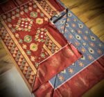 Slate Grey & Rust Satin Saree with Traditional Ikat Motifs and Zari Border