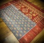 Slate Grey & Rust Satin Saree with Traditional Ikat Motifs and Zari Border