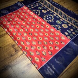 Vermilion Red & Royal Blue Satin Saree with Ikat Motifs and Zari Peacock Border