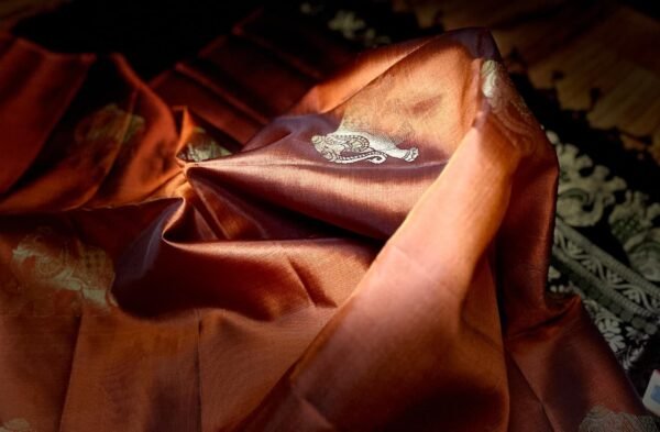 Burnt Orange Kanchipuram Silk Saree with Gold Zari Meena Elephant Butta and Black Temple Border Pallu