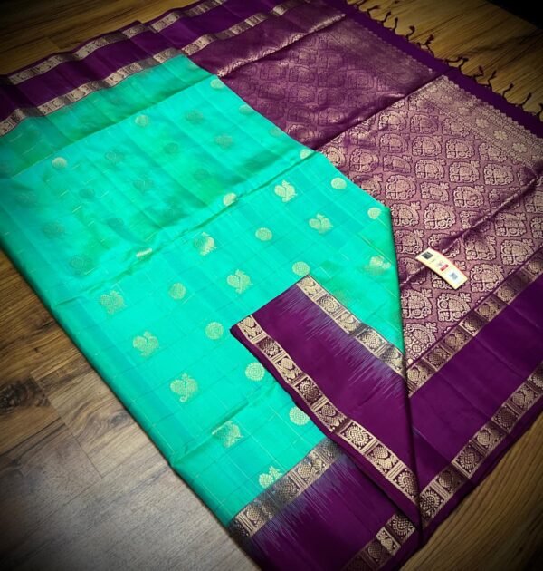 Sea Green Kanchipuram Silk Saree with Gold Zari Buttas and Royal Purple Contrast Pallu