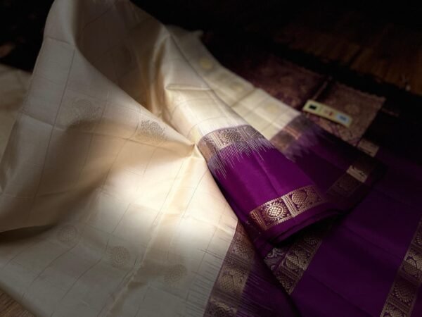 Ivory White Kanchipuram Silk Saree with Gold Zari Buttas and Royal Purple Contrast Pallu