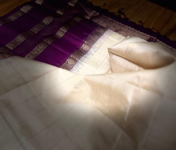 Ivory White Kanchipuram Silk Saree with Gold Zari Buttas and Royal Purple Contrast Pallu