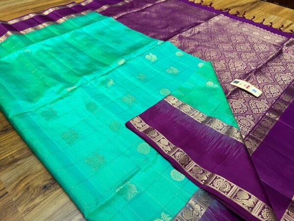 Sea Green Kanchipuram Silk Saree with Gold Zari Buttas and Royal Purple Contrast Pallu