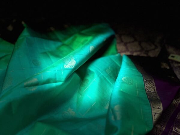 Sea Green Kanchipuram Silk Saree with Gold Zari Buttas and Royal Purple Contrast Pallu