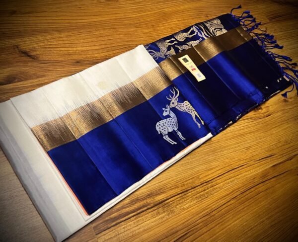 Elegant White Gold Zari Silk Saree with Royal Blue Deer Motif Border