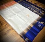 Elegant White Gold Zari Silk Saree with Royal Blue Deer Motif Border