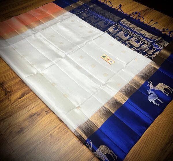 Elegant White Gold Zari Silk Saree with Royal Blue Deer Motif Border