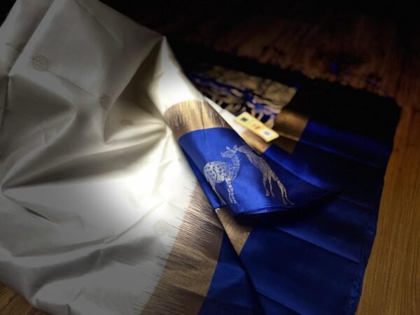 Elegant White Gold Zari Silk Saree with Royal Blue Deer Motif Border