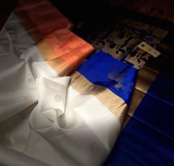 Elegant White Gold Zari Silk Saree with Royal Blue Deer Motif Border