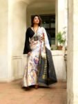 Elegant Ivory Pochampally Ikat Saree with Peacock & Deer Motifs and Rich Gold Zari Pallu