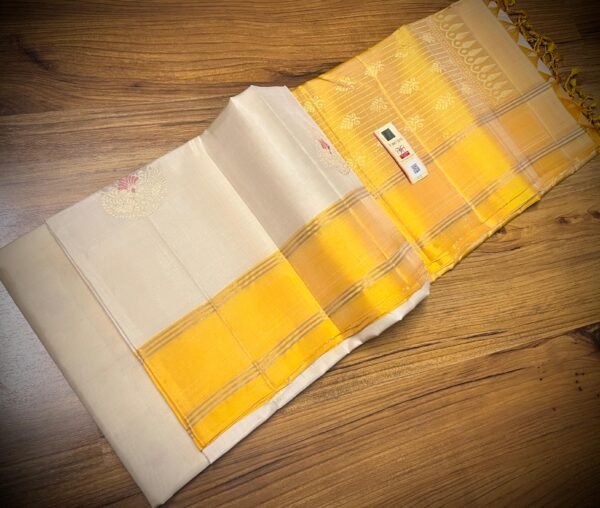 Elegant White Silk Saree with Gold Zari Buttas & Rich Yellow Pallu