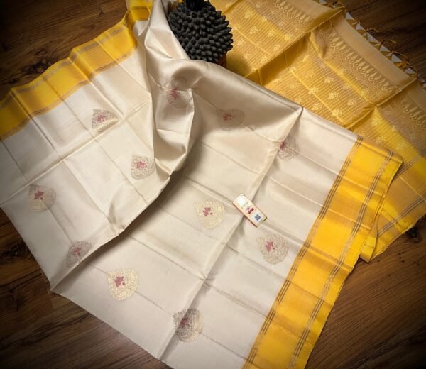 Elegant White Silk Saree with Gold Zari Buttas & Rich Yellow Pallu