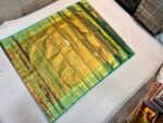 Luxurious Metallic Gold Soft Silk Saree with Rama Green Brocade Pallu and Peacock Motif Border