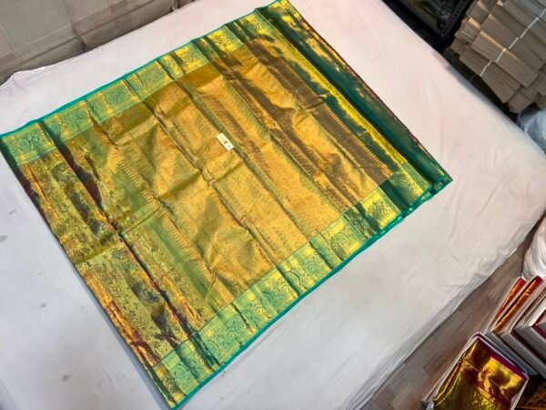 Luxurious Metallic Gold Soft Silk Saree with Rama Green Brocade Pallu and Peacock Motif Border